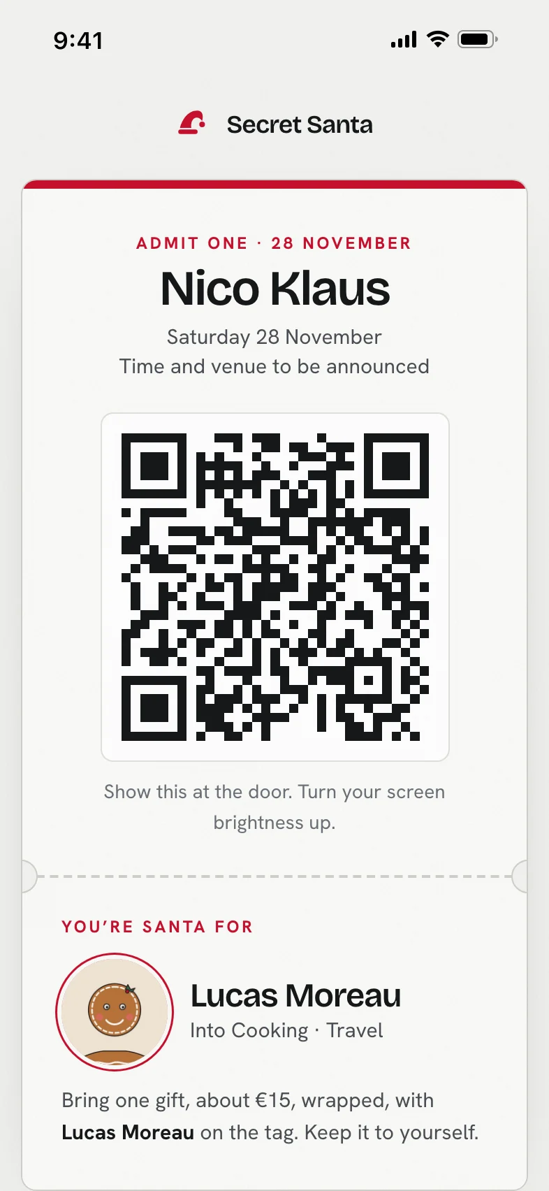 A ticket on a phone: Admit one, 28 November, a guest's name, a QR code to show at the door, and under it who they are Santa for, with that person's photo and interests.